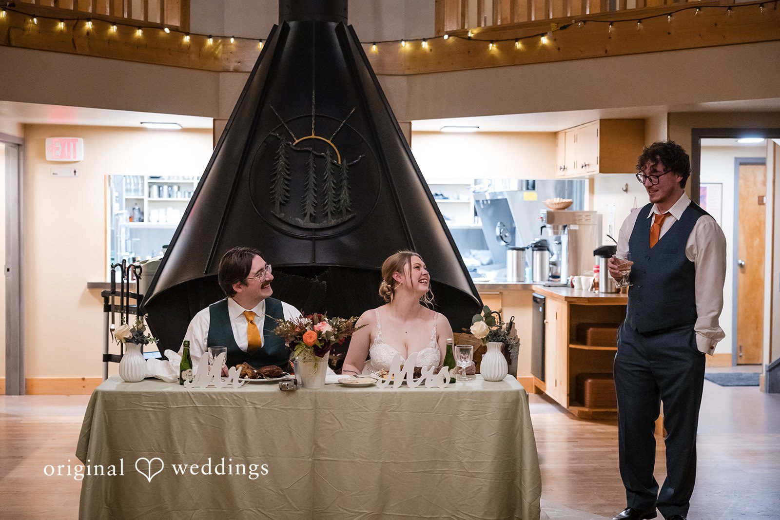 A happy portrait of the couple at their wedding reception