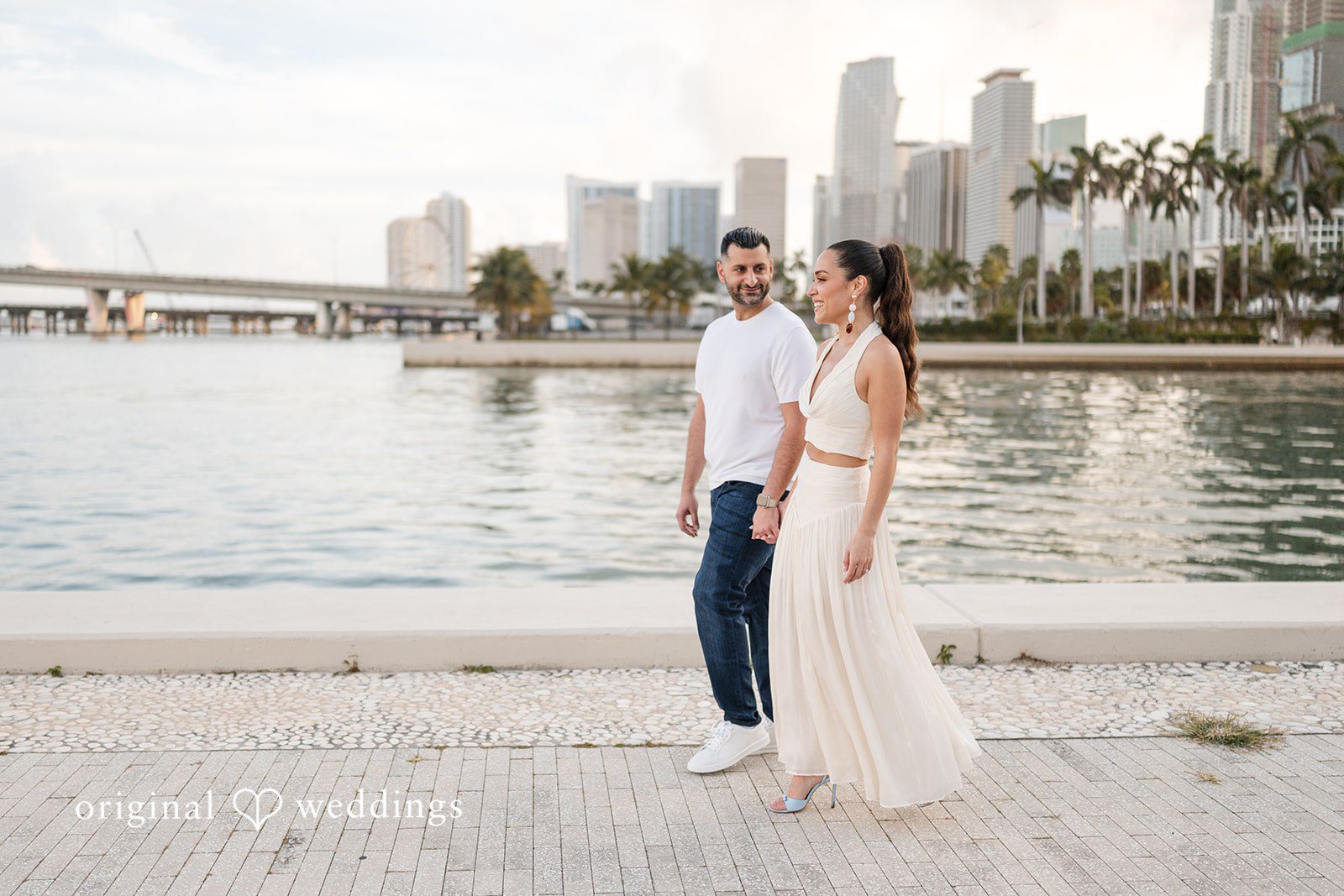 A peaceful pose by the water capturing elegance and love.
