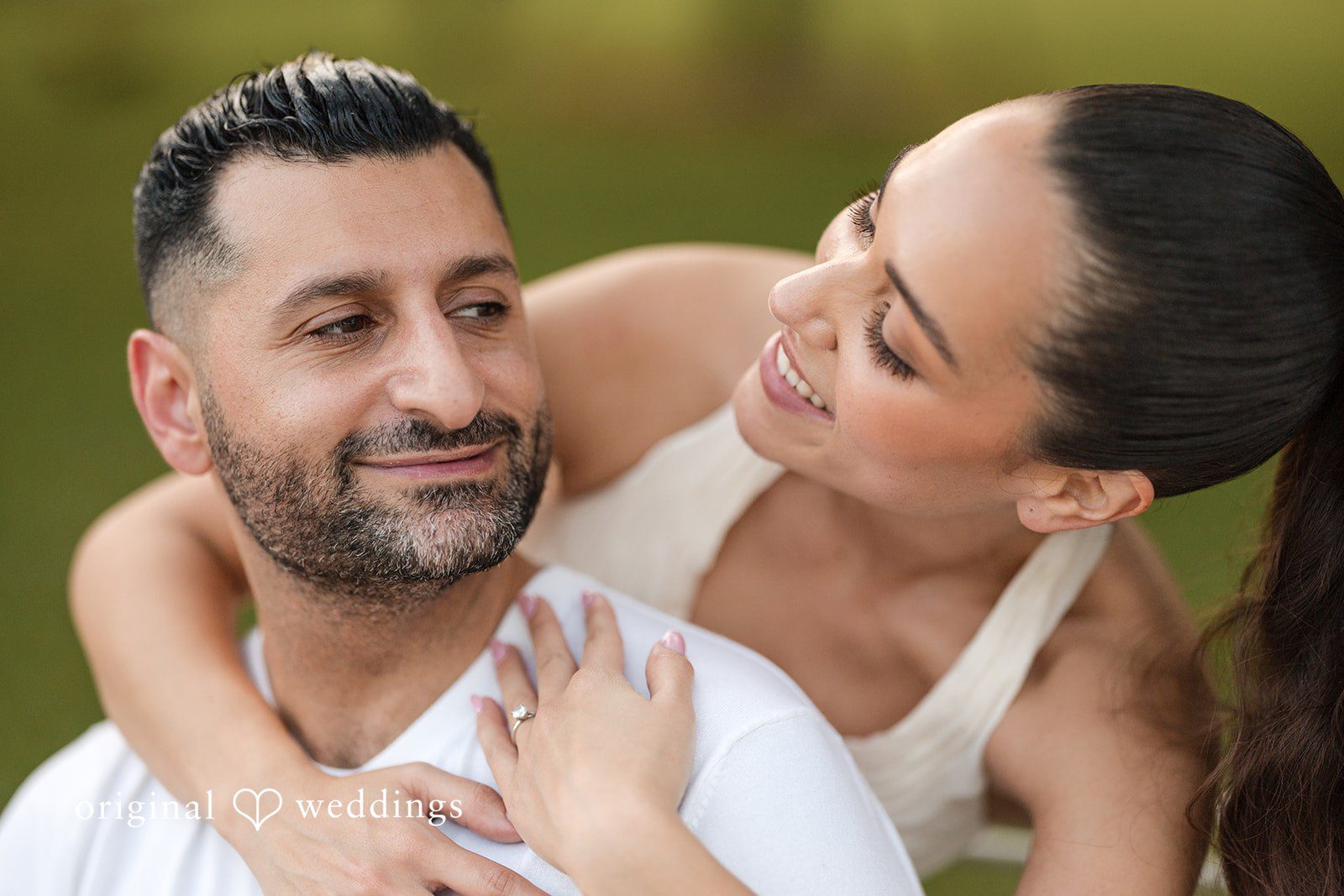 Running freely together in a park full of love.
