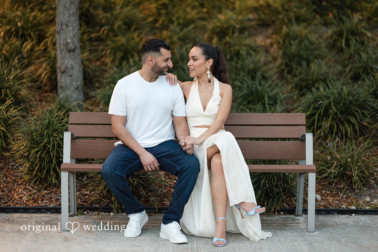 A calm and intimate moment shared on a quiet bench.