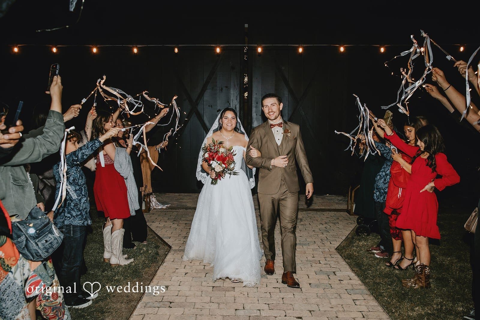 Our Austin wedding photographers at Original Weddings captured a beautiful grand exit of the couple after their Two Wishes Ranch wedding reception.