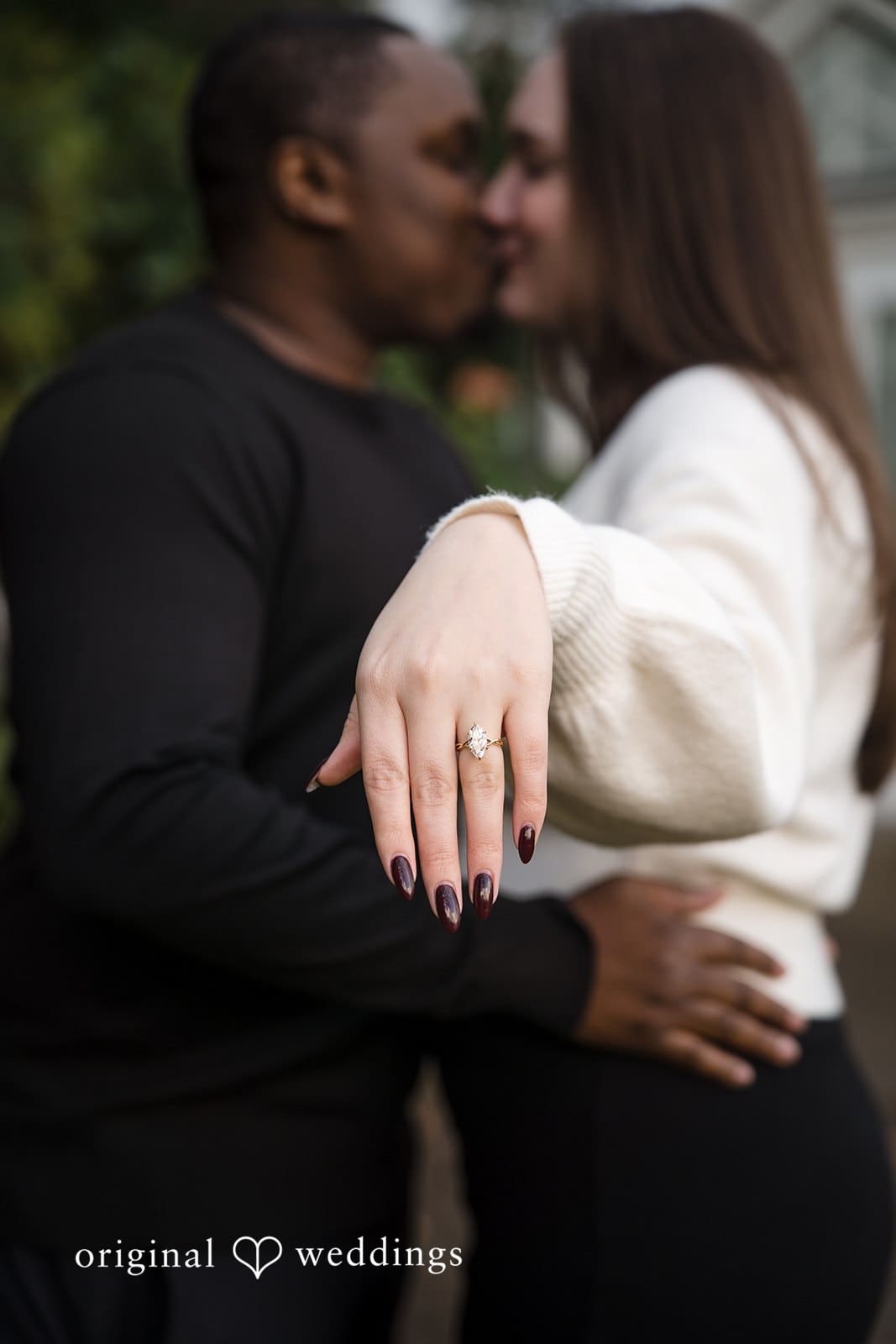 The bride shows off her engagement ring