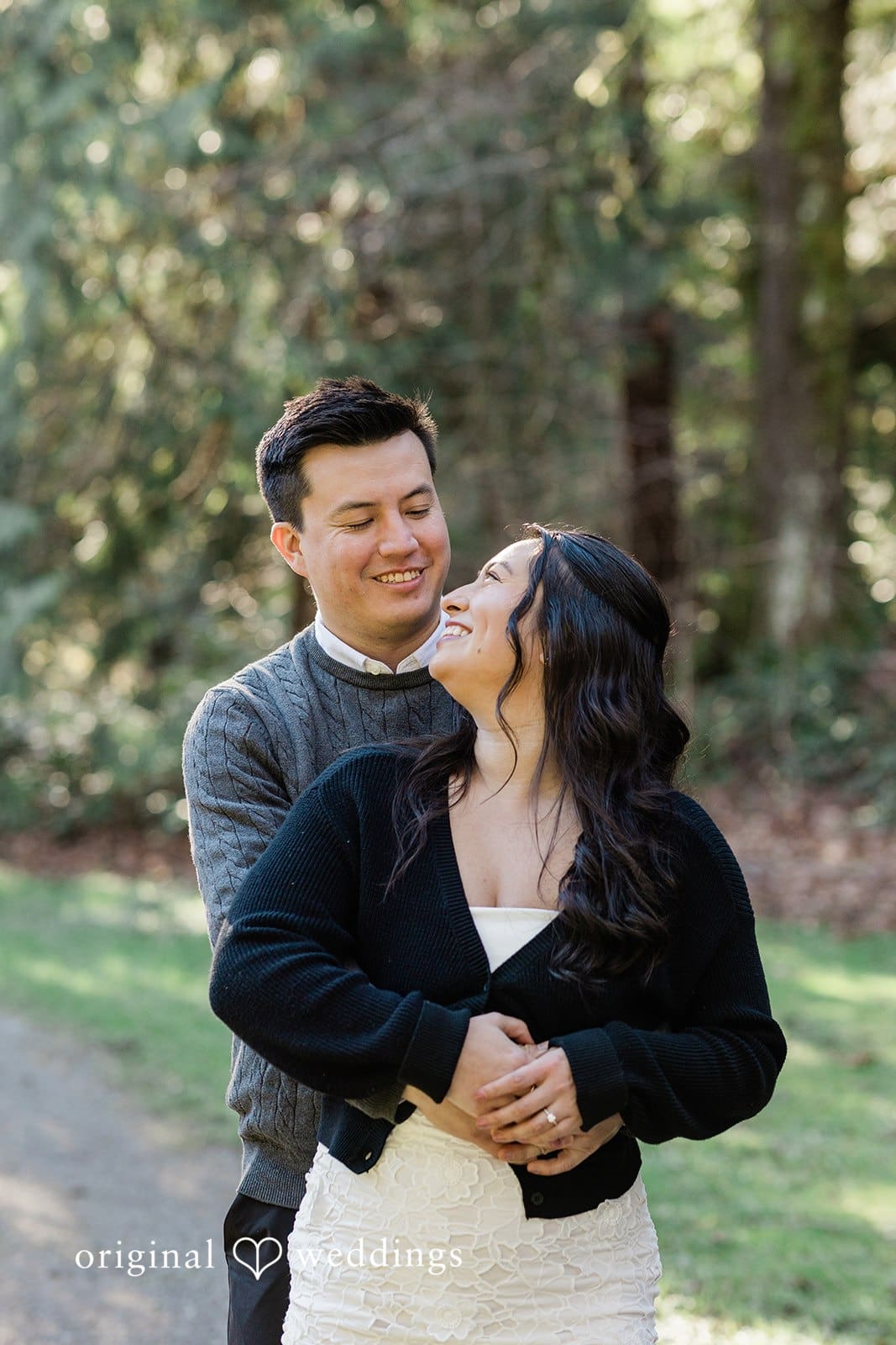 Close-up of couple sharing a back hug at Washington Park Arboretum