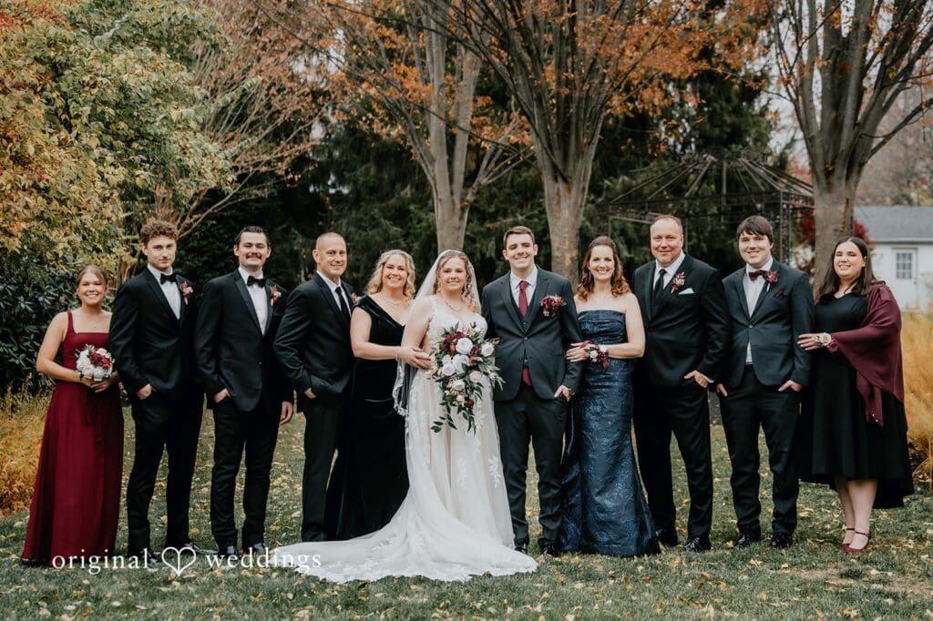 Our Philadelphia wedding photographer at Original Weddings captured a stunning portrait of the bride and groom with their wedding party at William Penn Inn