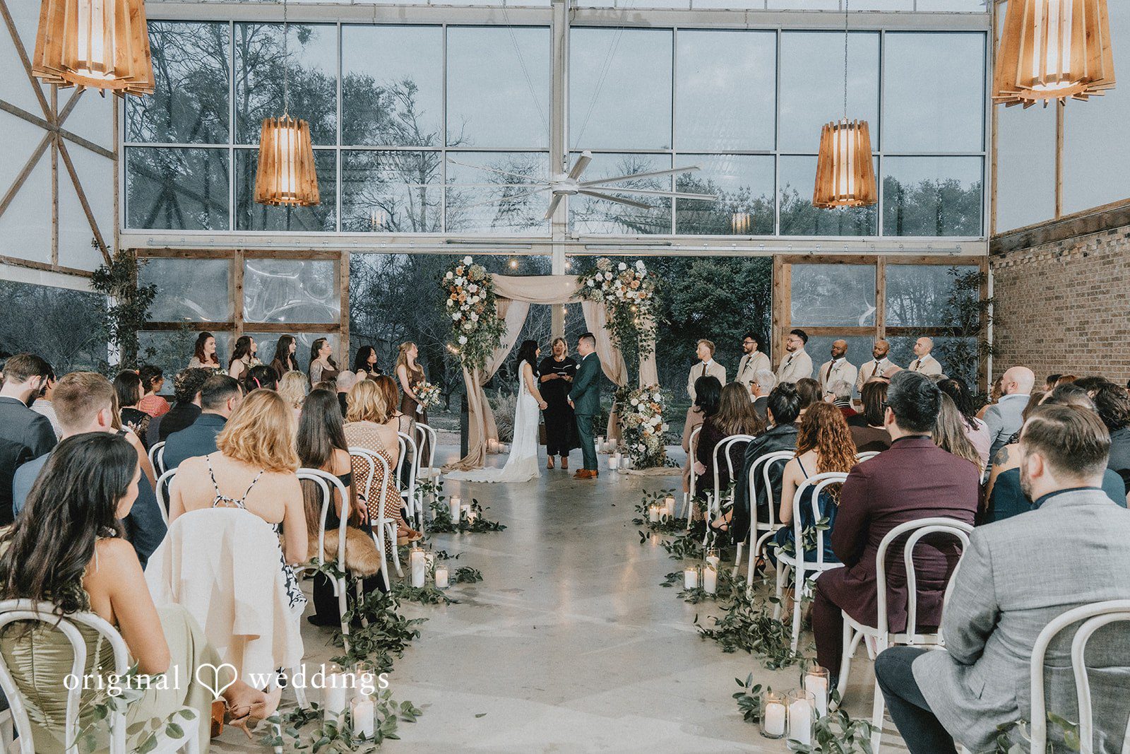 The bride, groom, and wedding guests at the wedding ceremony