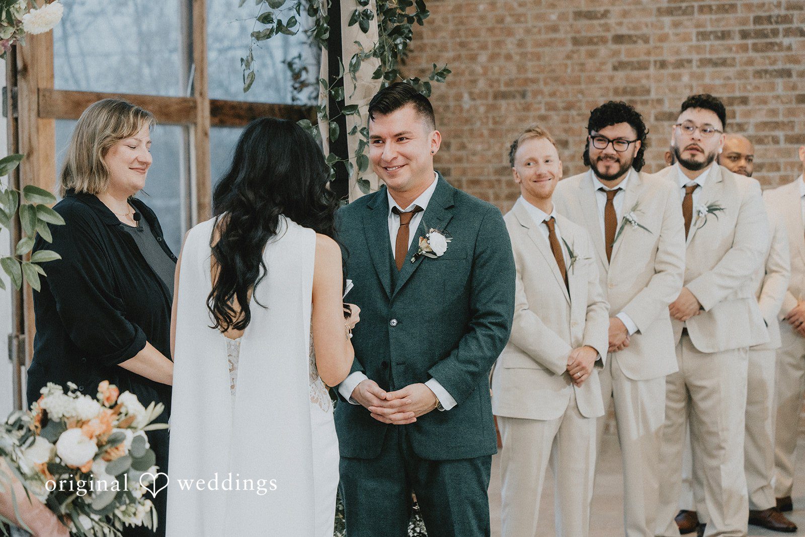The bride and groom exchange marital vows at Barr Mansion