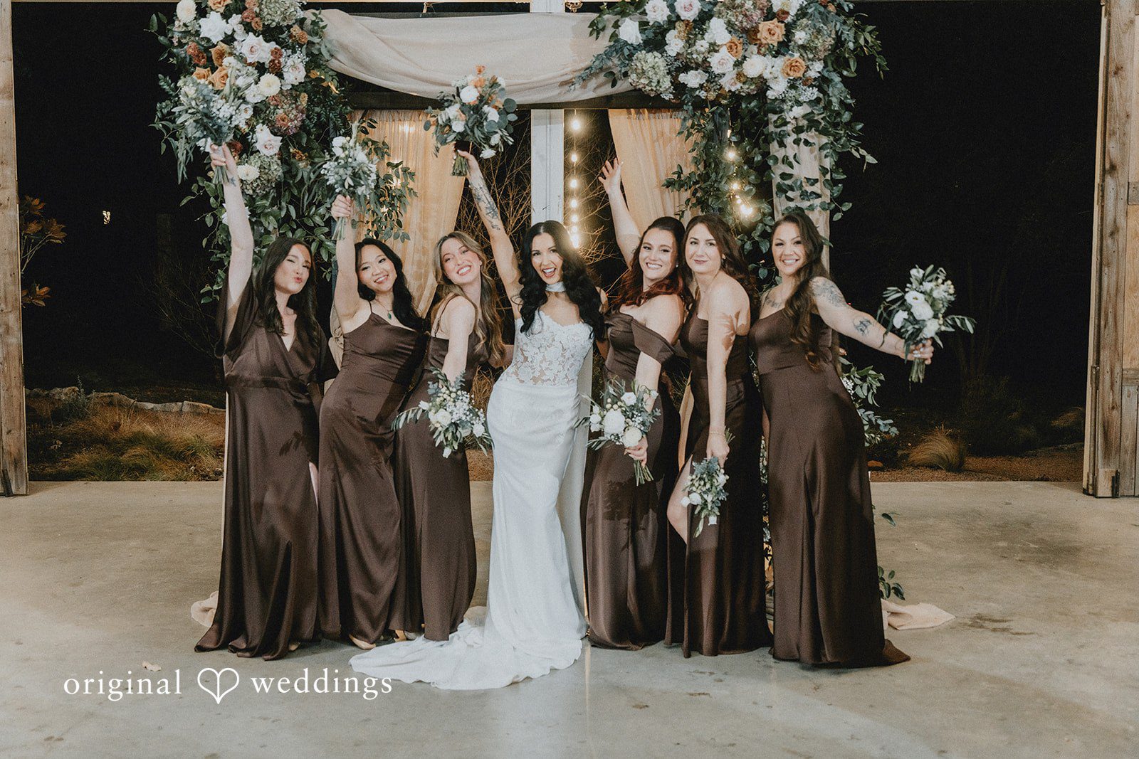 A joyful portrait of the bride and her bridesmaids