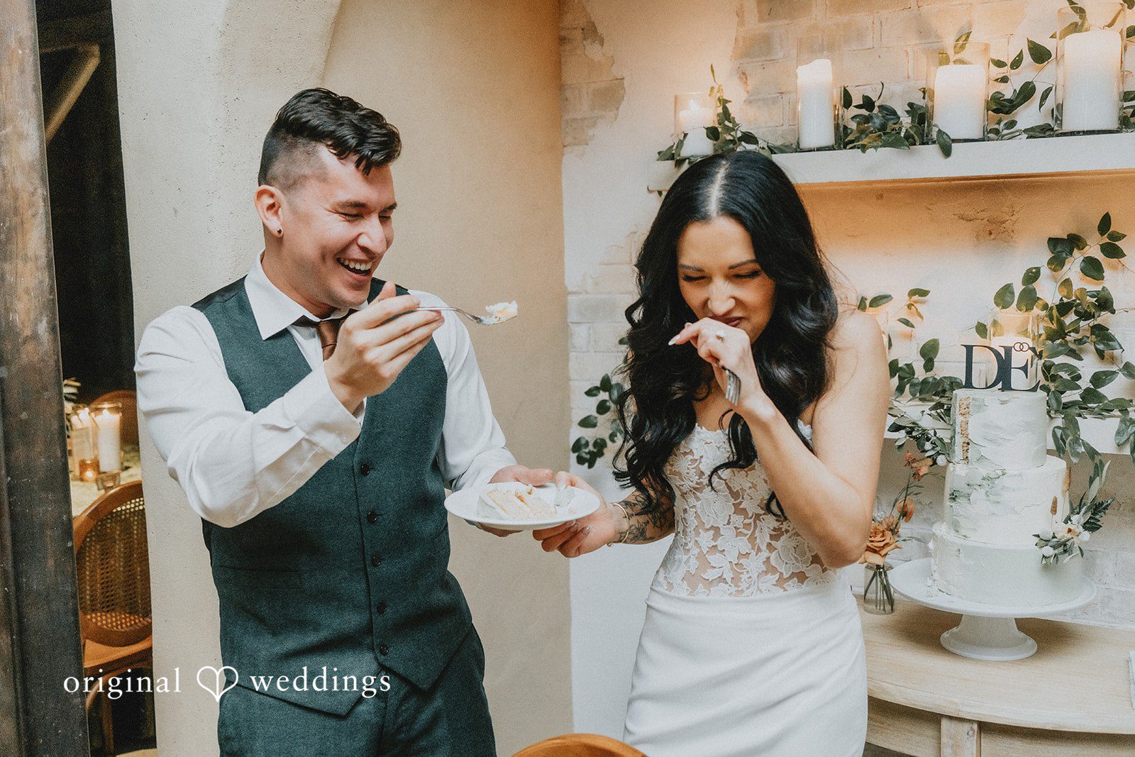 The couple playfully feed each other