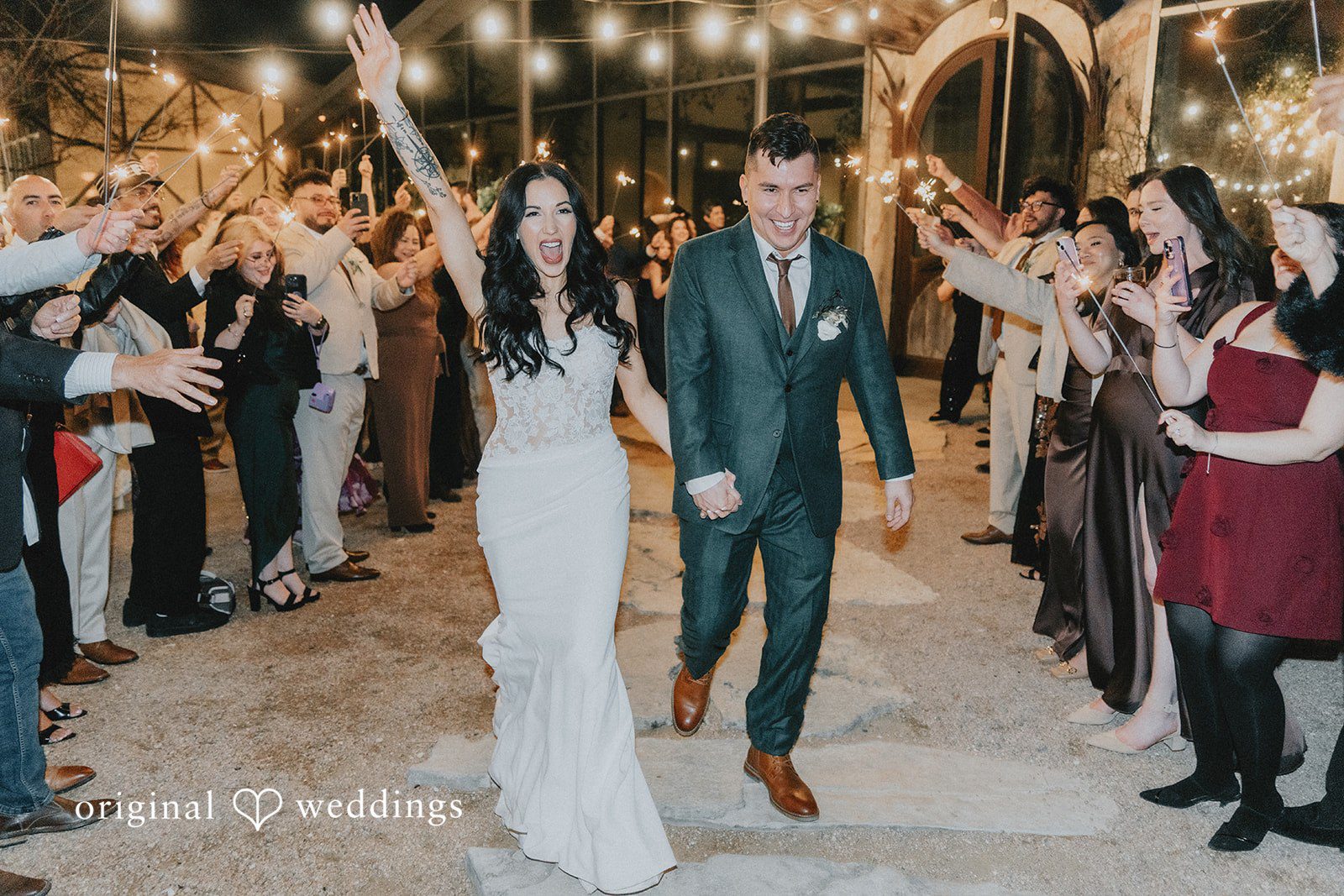 The couple makes a grand exit with guests cheering them on
