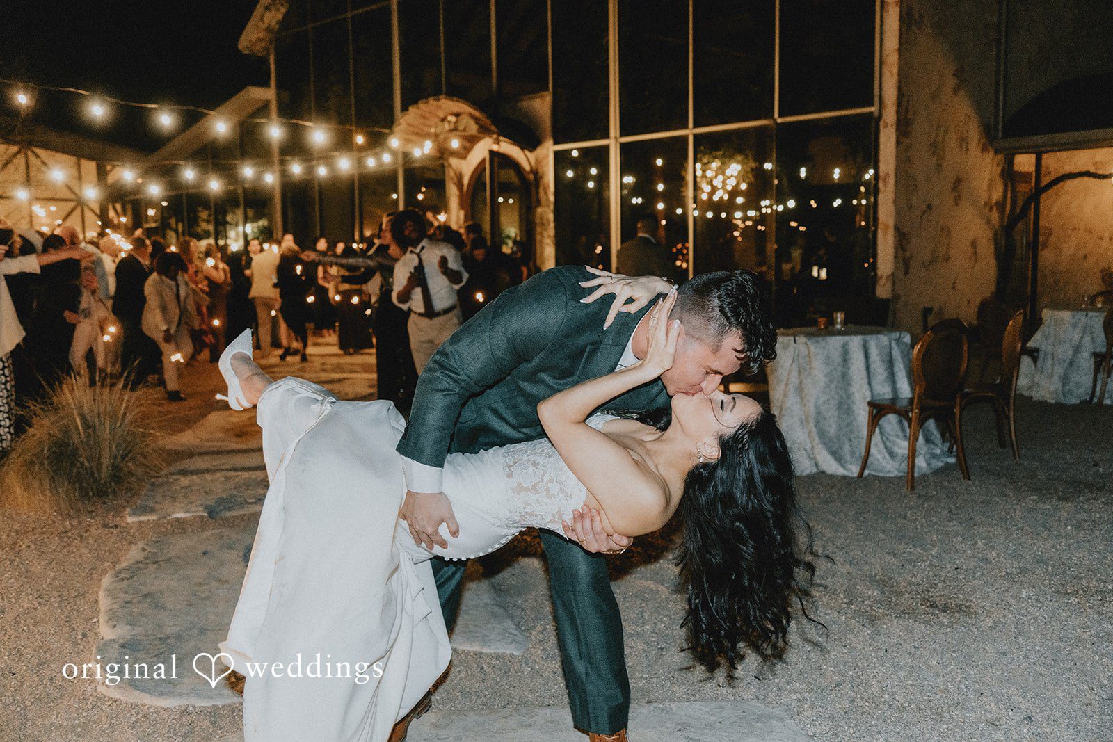 The couple seals the night with a romantic kiss