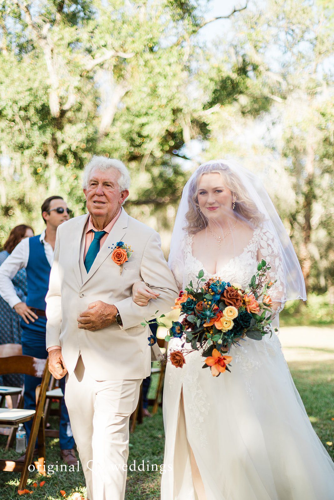 A meaningful ceremony entrance moment captured naturally by Tampa Wedding Photography.