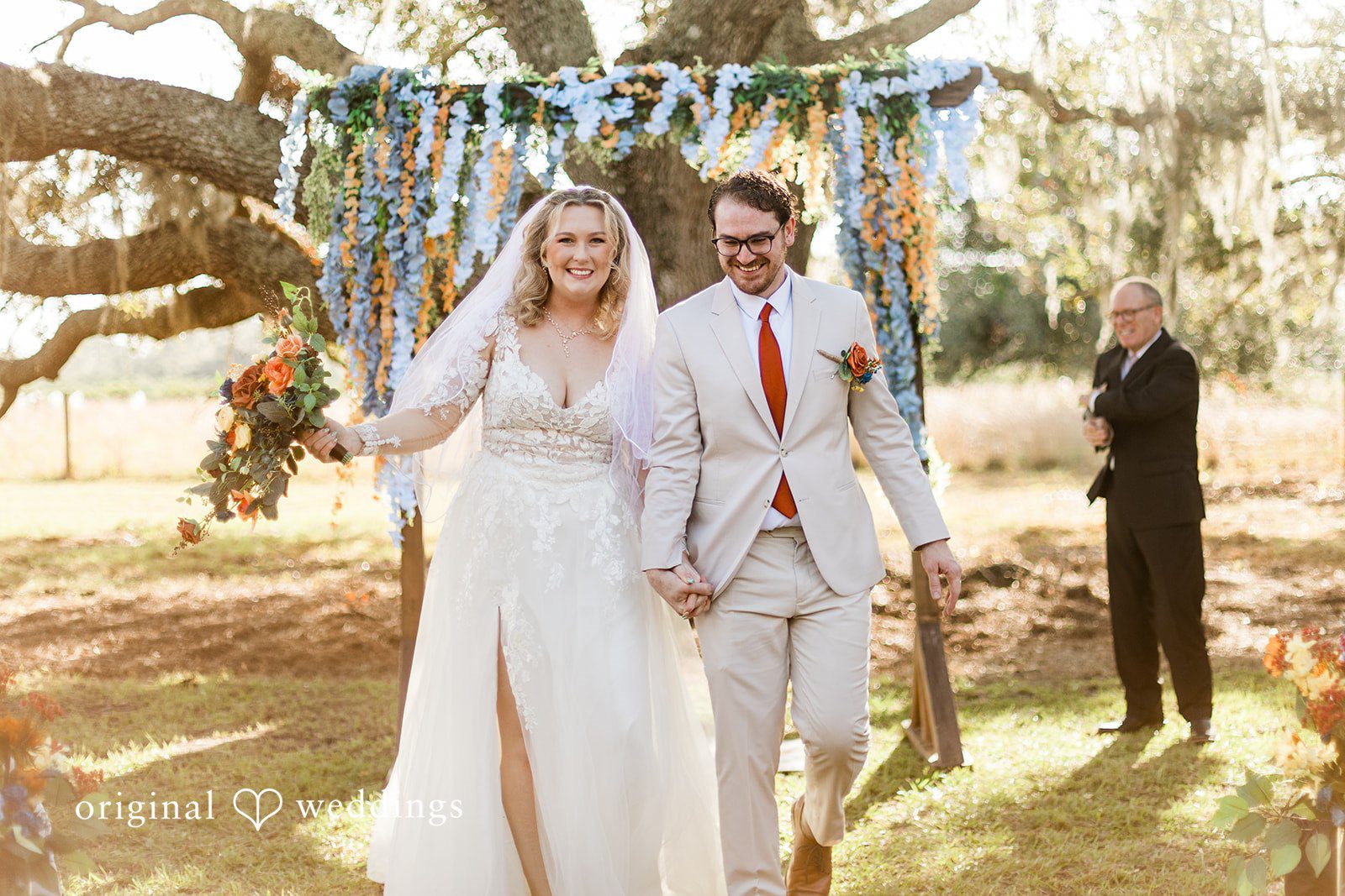 A walk down the aisle after the ceremony, photographed by Tampa Wedding Photography.