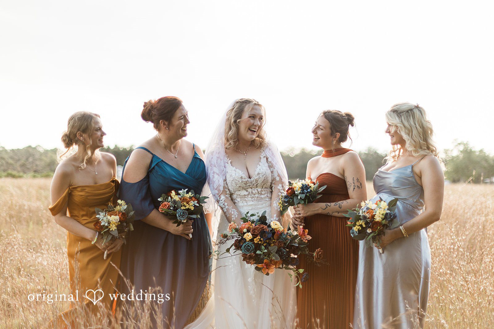 A group portrait in an open field with florals, reflecting Tampa Wedding Photography aesthetics.