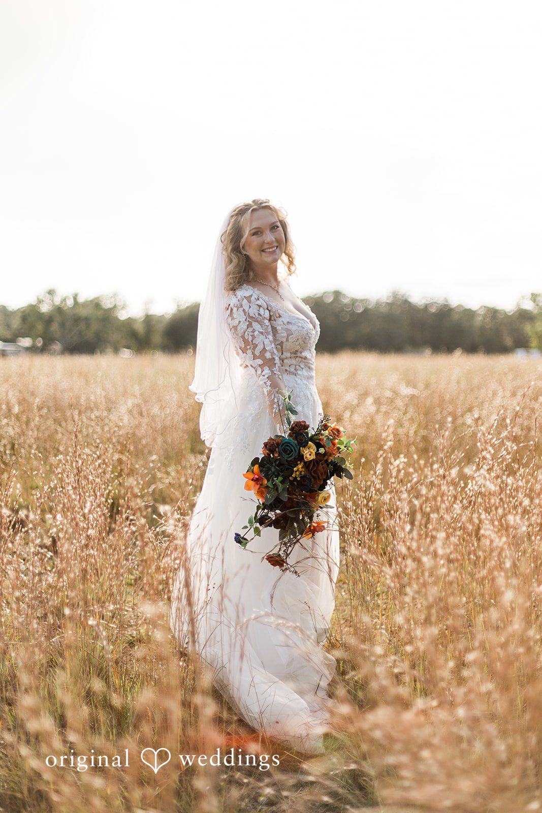 A solo portrait in an open field, styled with the romantic touch of Tampa Wedding Photography.