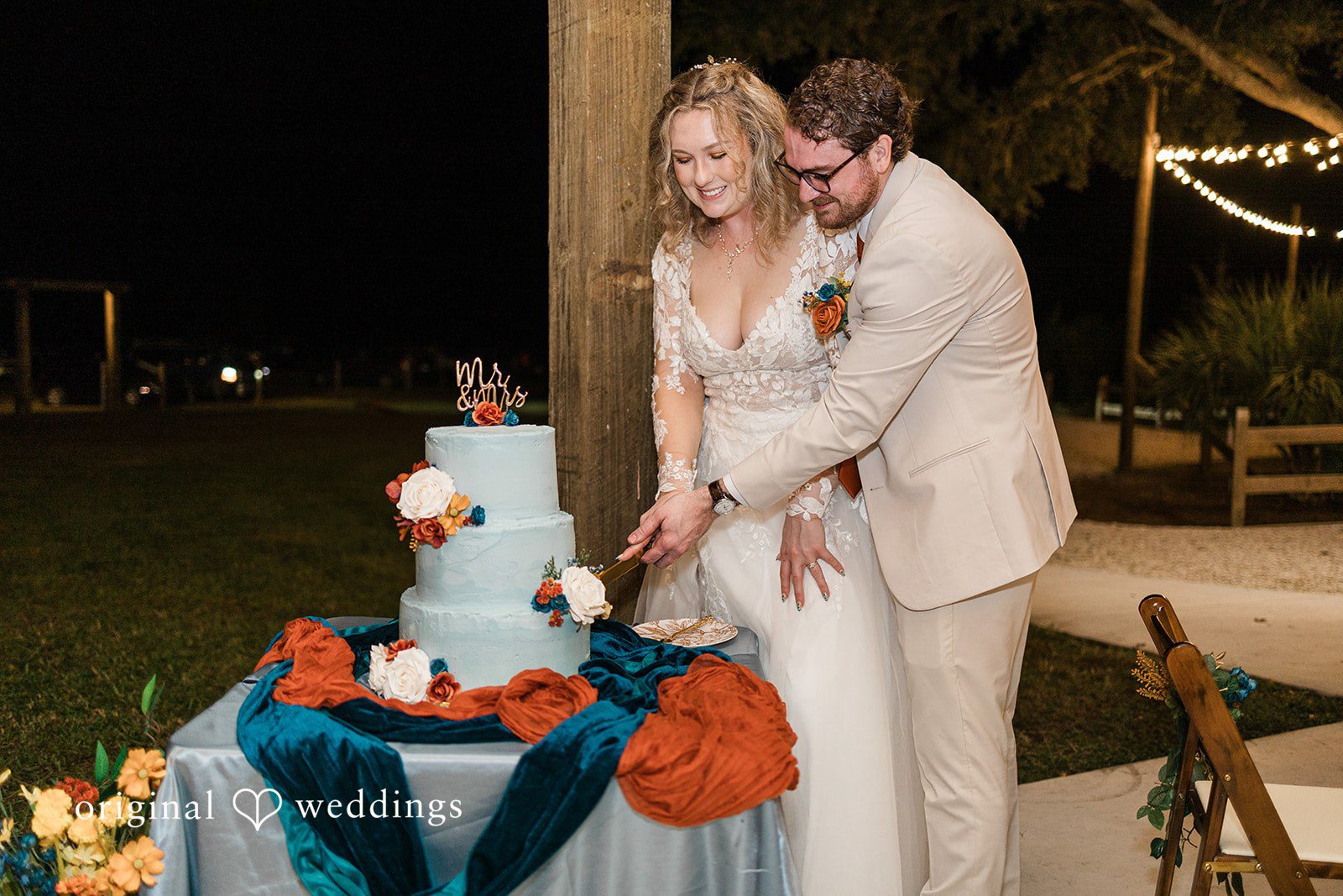 A wedding cake cutting moment during the reception, documented by Tampa Wedding Photography.