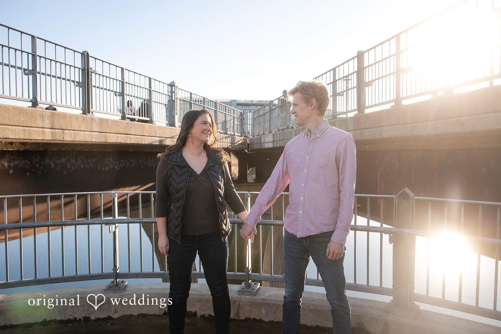 A romantic portrait of the couple by the Pfluger Pedestrian Bridge