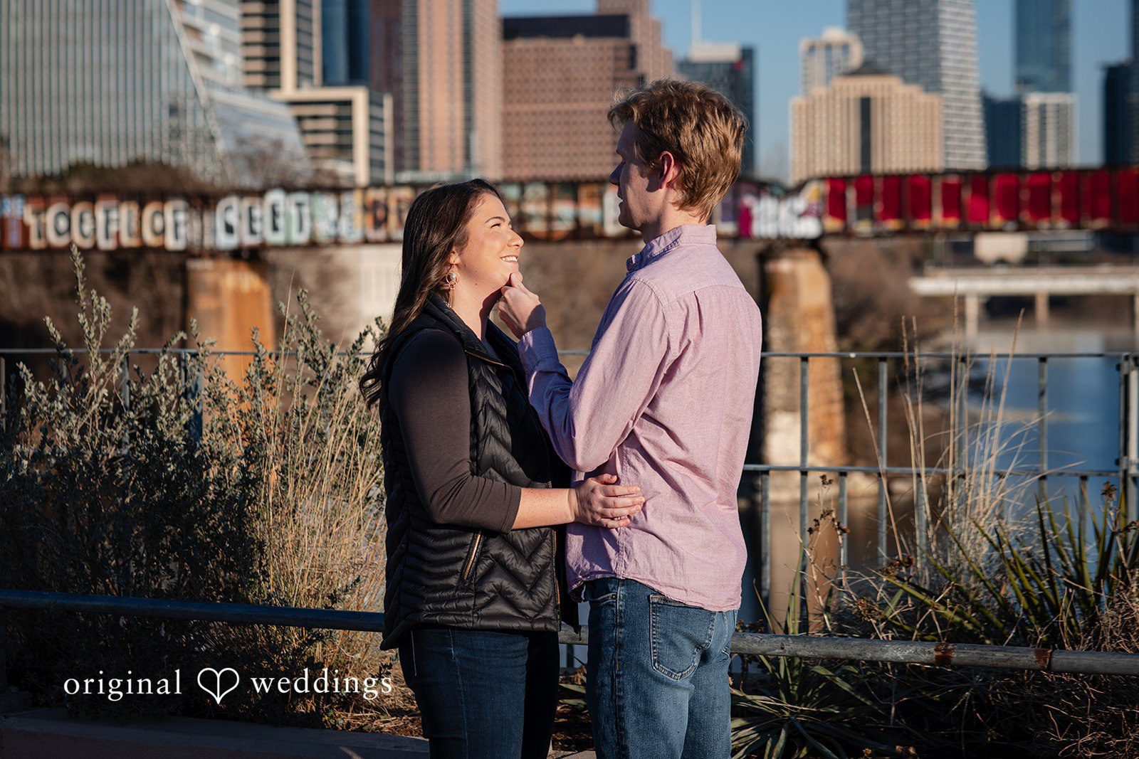 A romantic portrait of the couple by the Pfluger Pedestrian Bridge