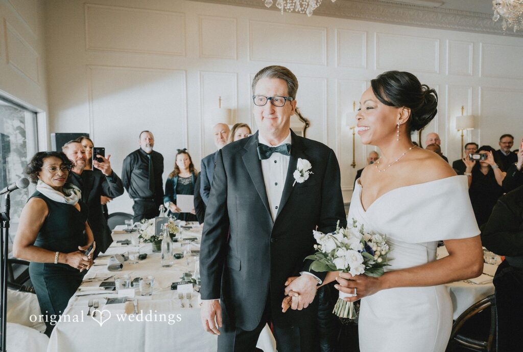 Sweet wedding picture of couple celebrating together holding hands at Cedar Knoll