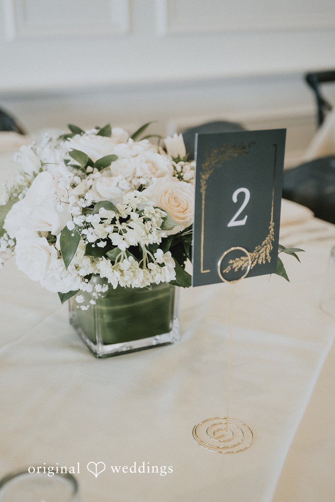 Elegant wedding table setup with floral arrangement at Cedar Knoll