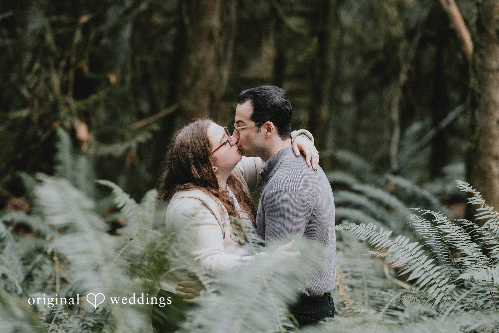 Romantic moment as couple leans in for a gentle kiss.