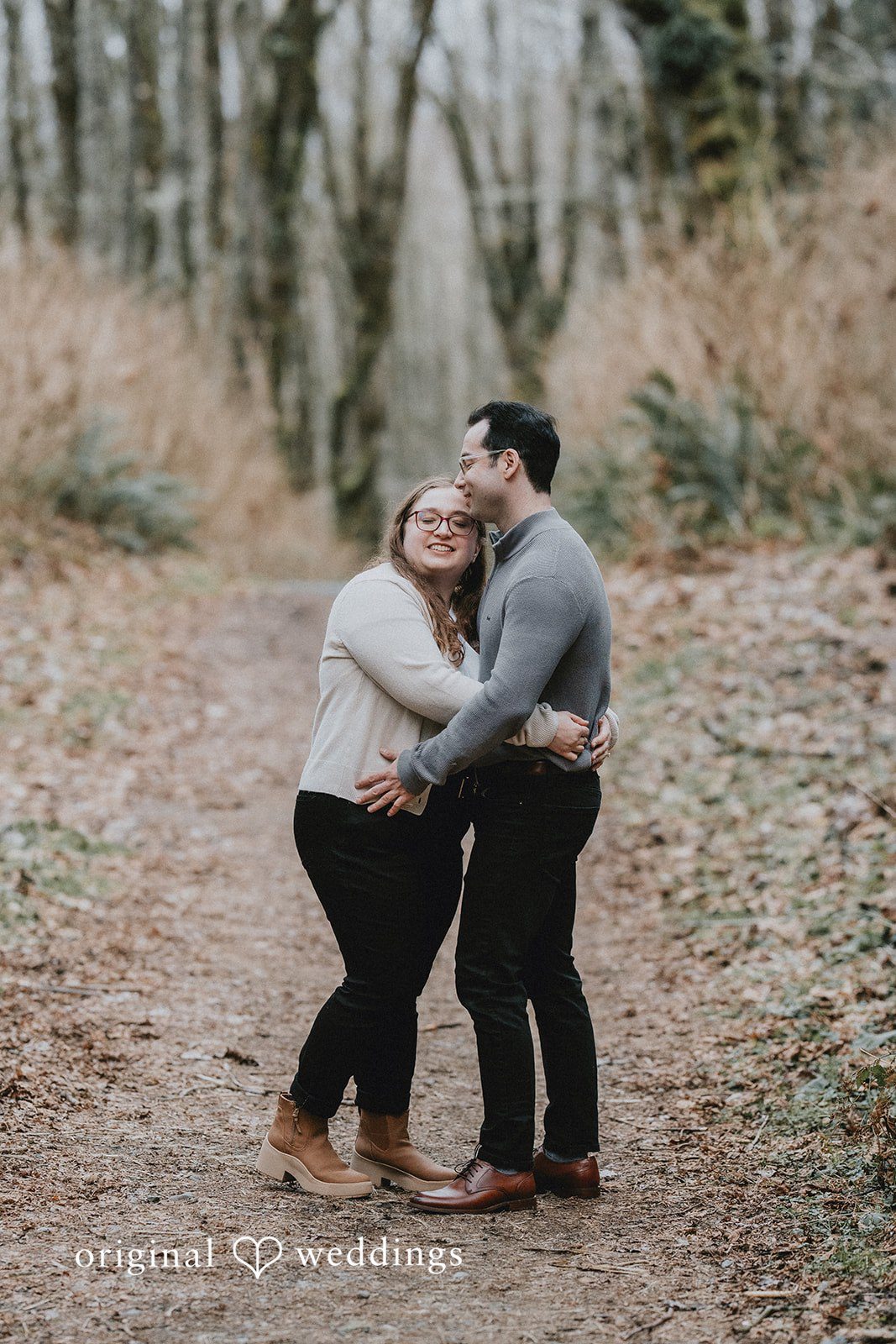 Couple hugging warmly with genuine smiles at Coal Creek Natural Area
