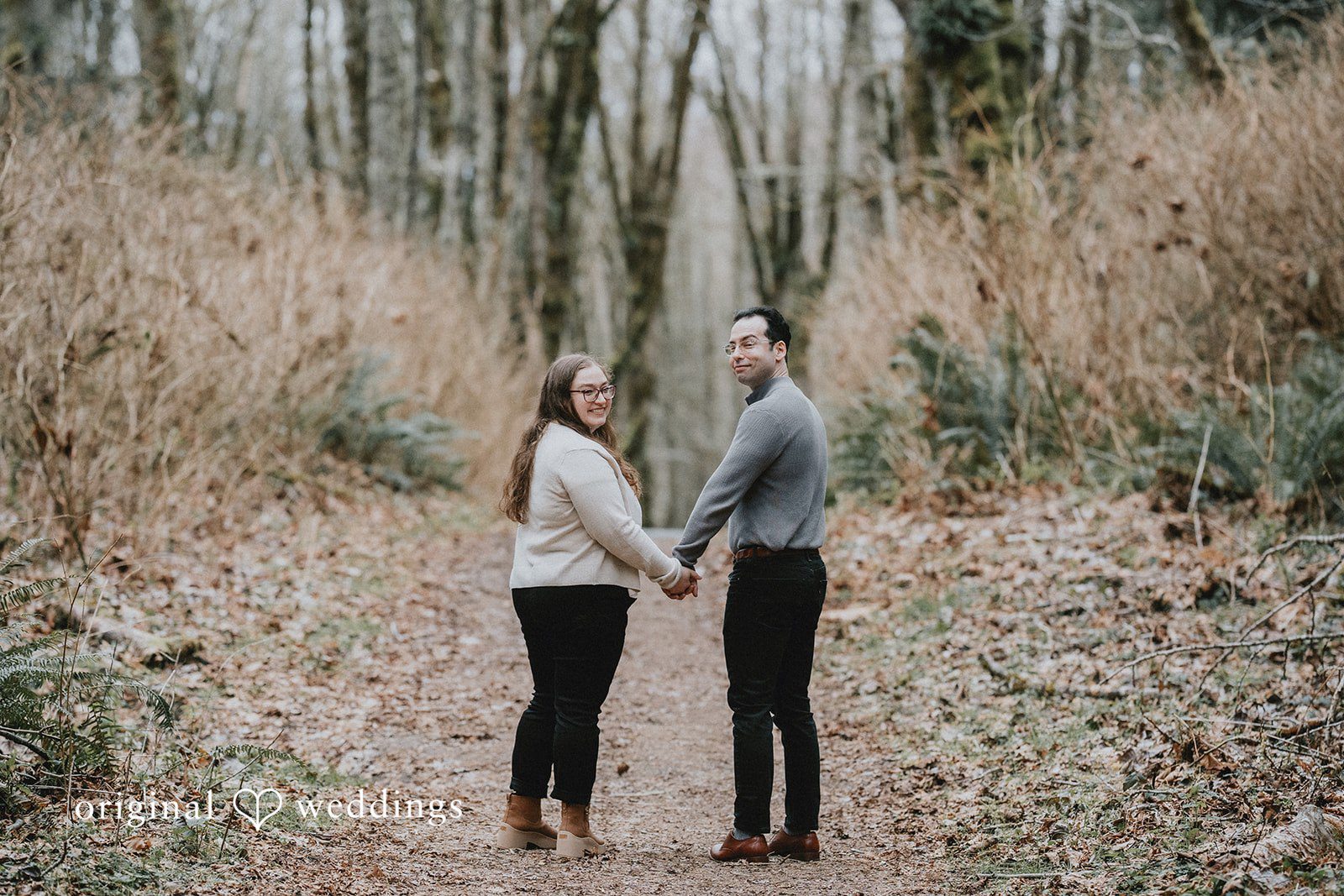Happy couple standing together with a calm and candid feel.
