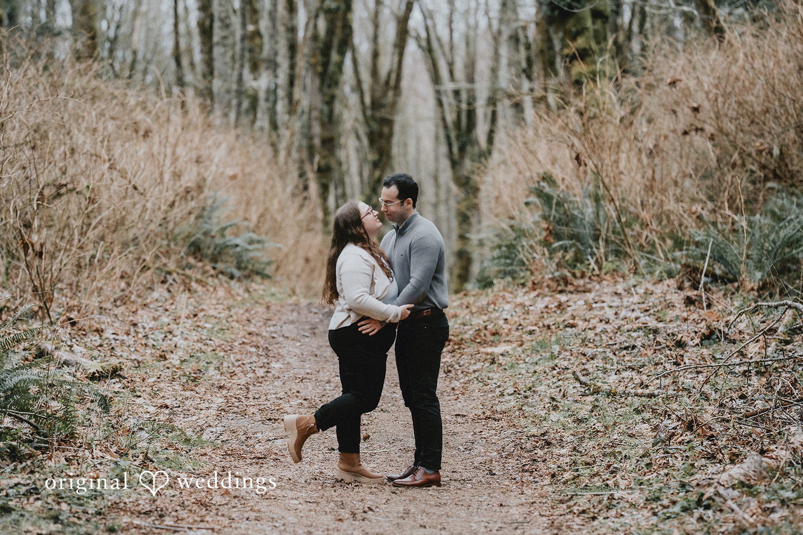 Loving pose with couple standing close and feeling at ease.