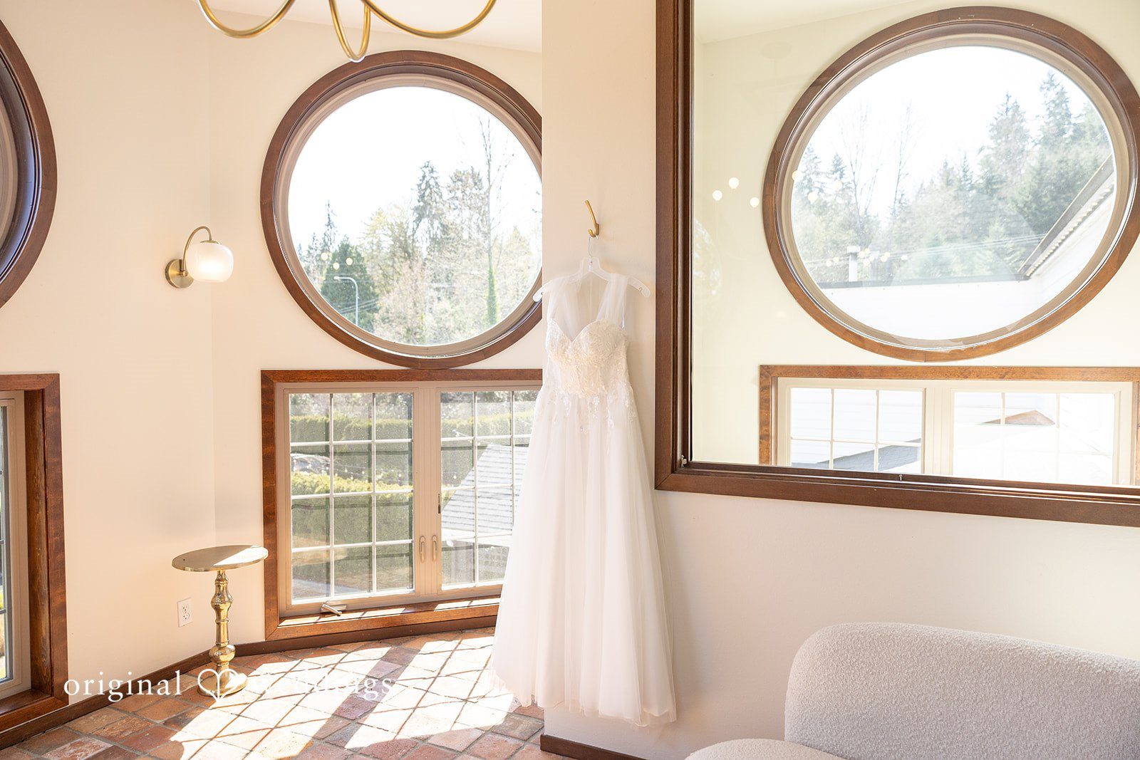 The bride's gown beautifully hanging in the lodge