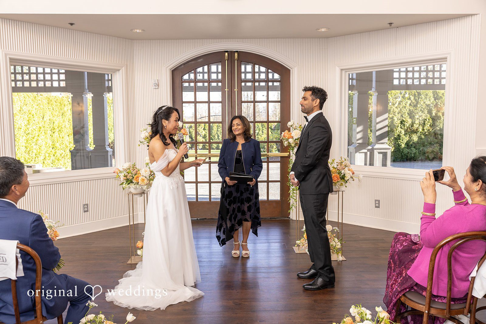 The bride reads her vows to the groom