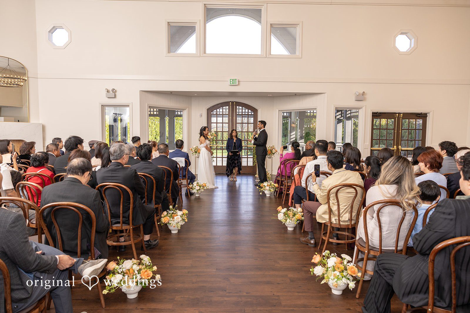 A moment from the wedding ceremony, the groom reads his vows to the bride