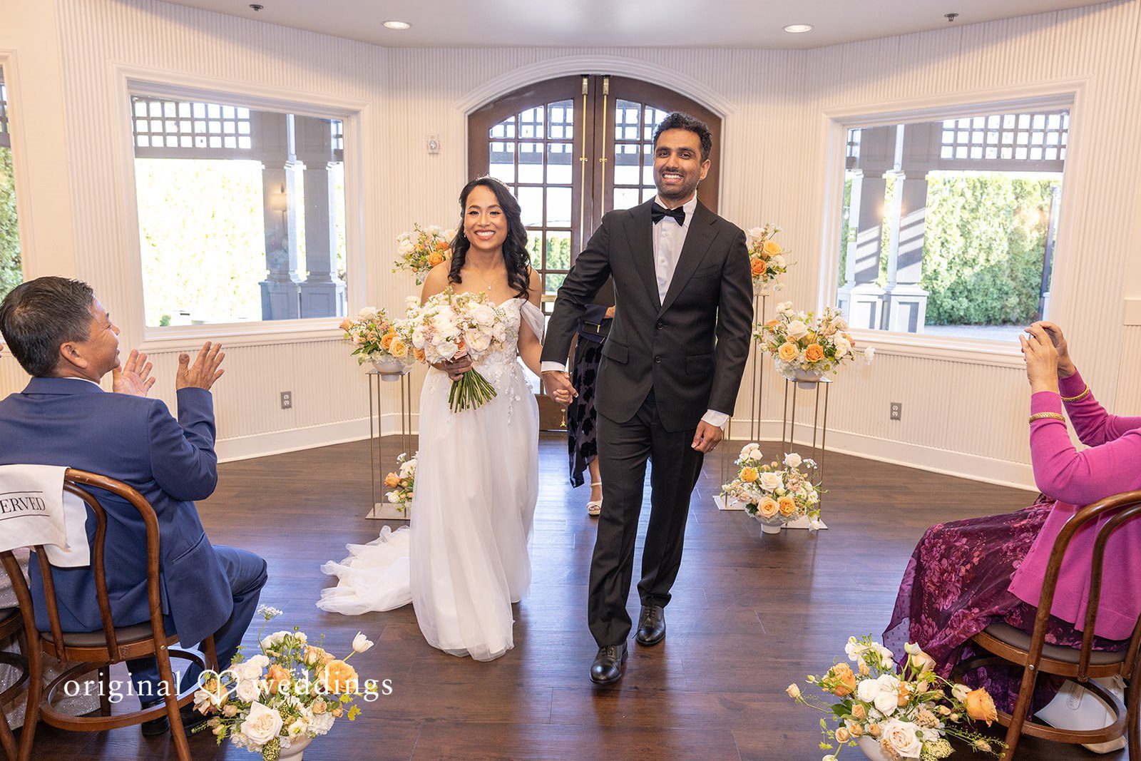A joyful exit of the couple after their wedding ceremony