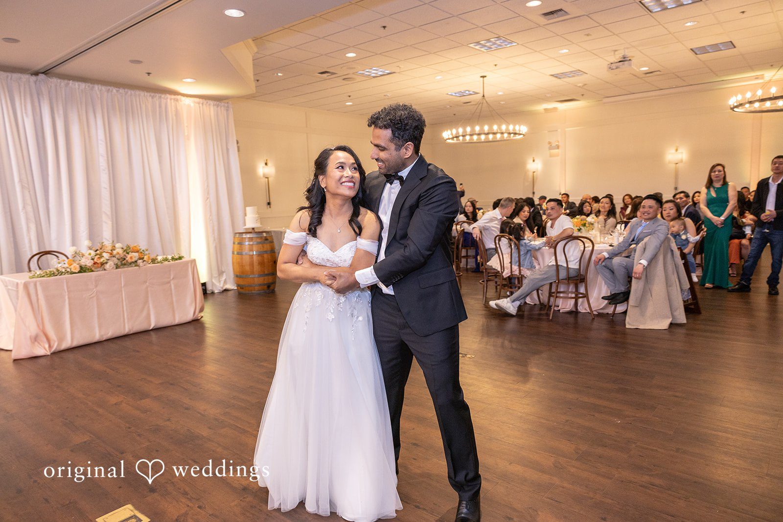 The couple dancing happily at their wedding reception