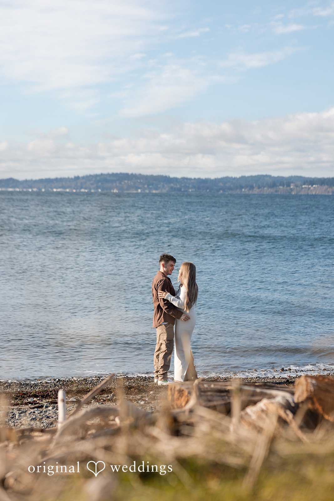 Couple enjoying engagement photography session with ocean views in discovery park