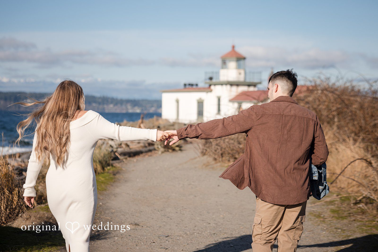 Natural engagement photography services capturing love by the shoreline in Seattle