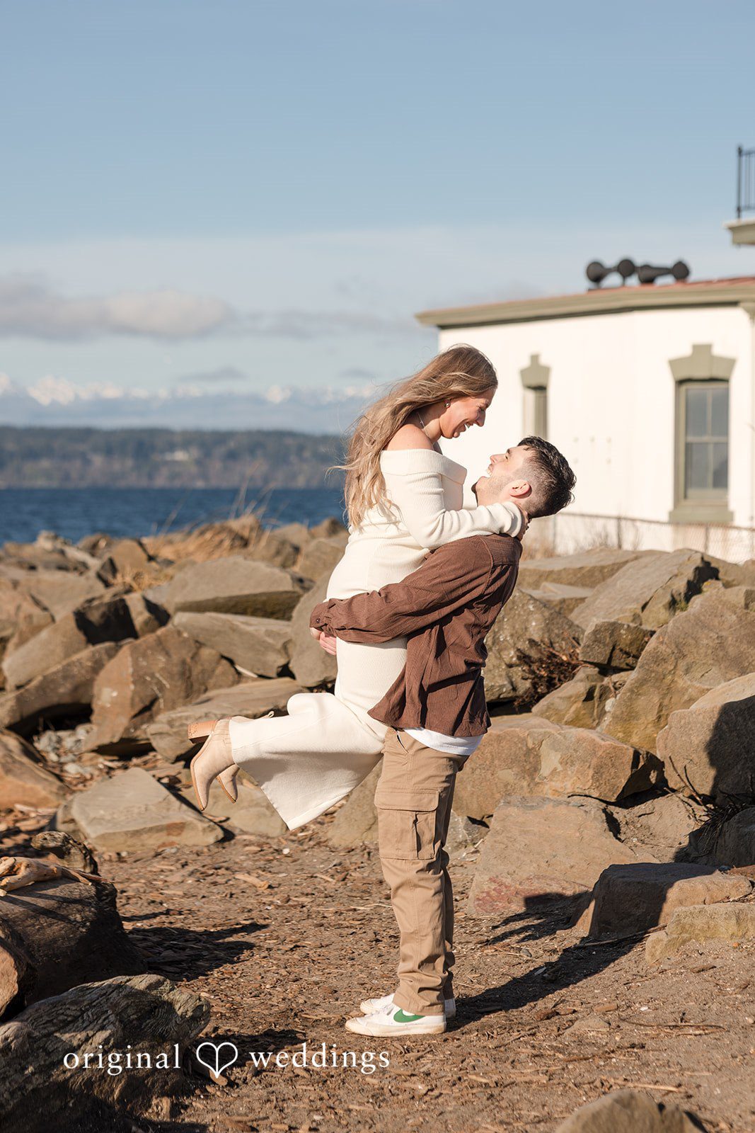 Candid couple interaction during engagement photography session at Discovery Park