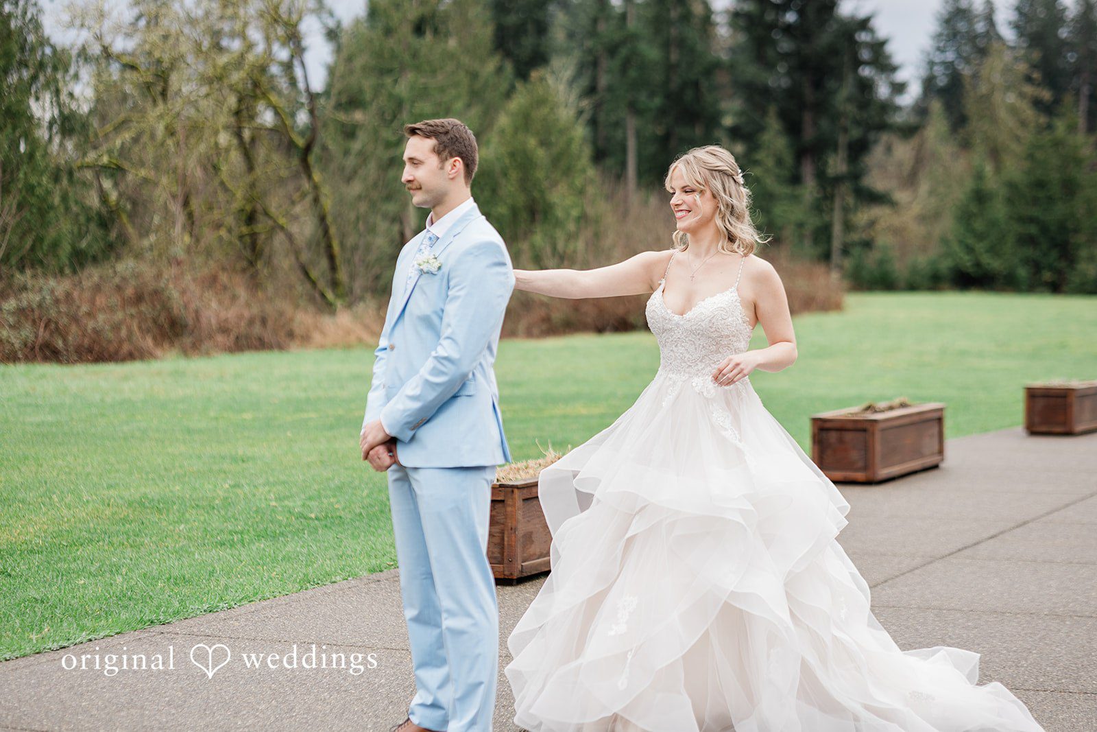 Aubrey + Casey The bride twirls playfully outdoors while holding the groom’s hand.