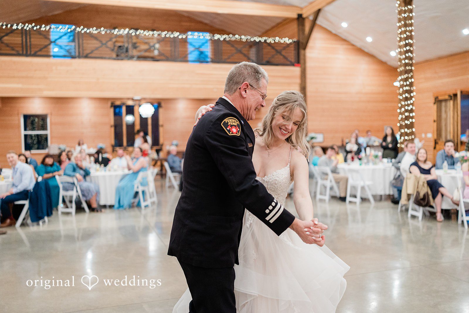 Aubrey + Casey The bride dances with an older guest, sharing a heartfelt moment.