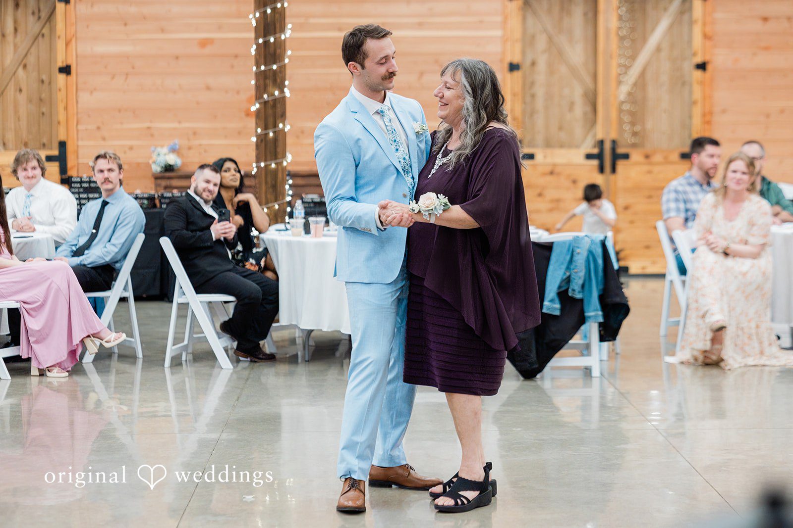 Aubrey + Casey The couple shares a sweet dance moment surrounded by guests.