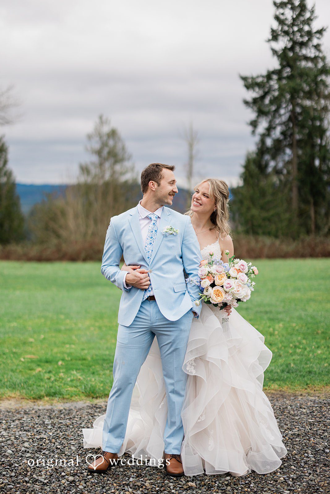 Aubrey + Casey The couple walks together outdoors, enjoying a quiet and romantic moment.