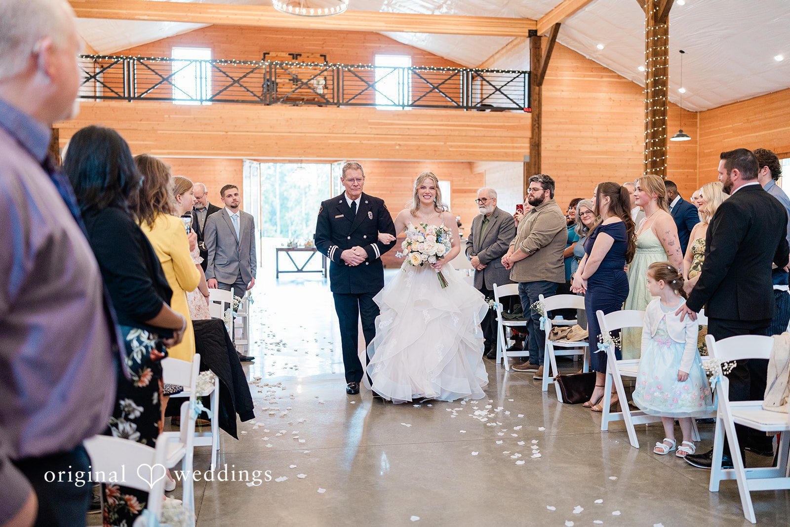 Aubrey + Casey Guests toss petals as the couple walks down the aisle after the ceremony.