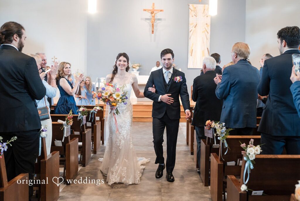 February 14, 2026 – Kelsey & Jensen – (ID-4399) Seattle Wedding Photographer capturing couple walking hand-in-hand outdoors at Edmonds Waterfront Center by Original Weddings