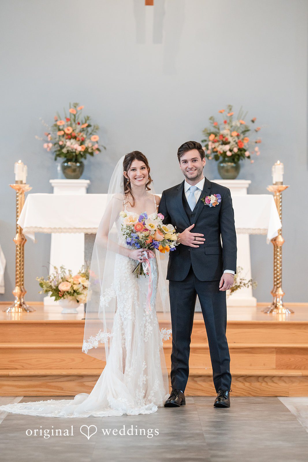Kelsey + Jensen Seattle Wedding Photographer capturing couple standing and smiling at Edmonds Waterfront Center by Original Weddings