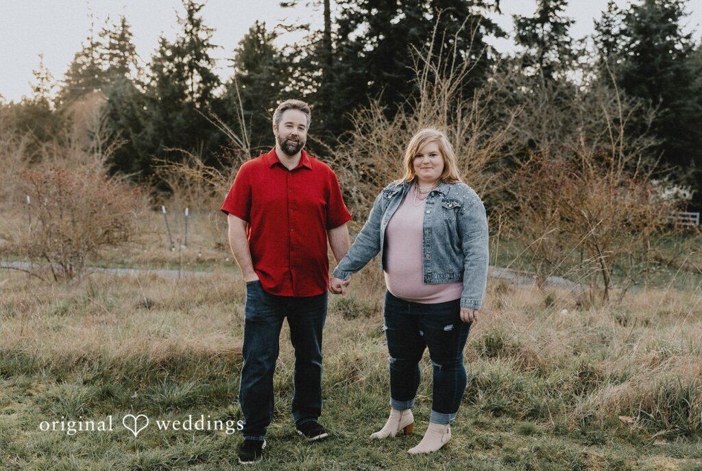 Engagement photography services by Original Weddings capturing couple holding hands and smiling at Hidden Farm & Stables