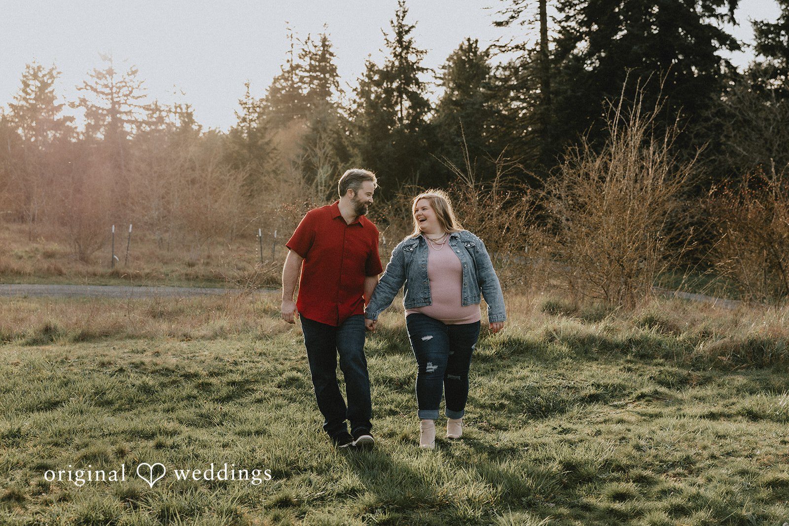 Couple walking together and smiling at Hidden Farm & Stables.