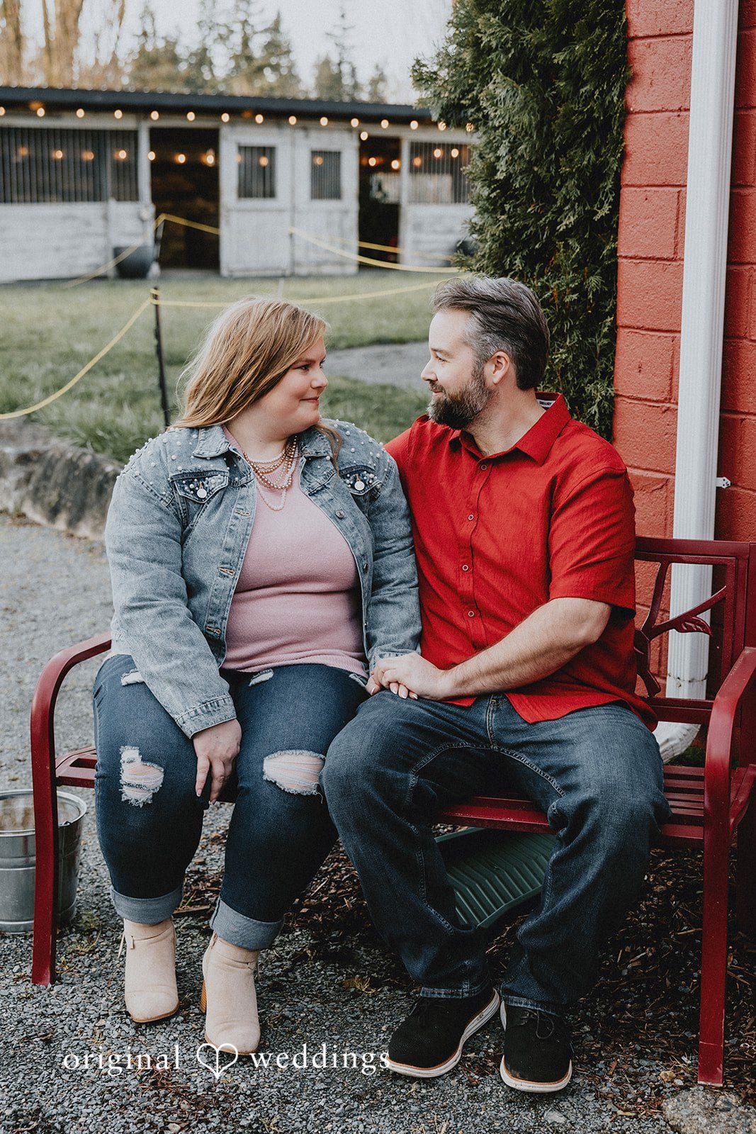 Romantic couple sitting on bench at Hidden Farm & Stables