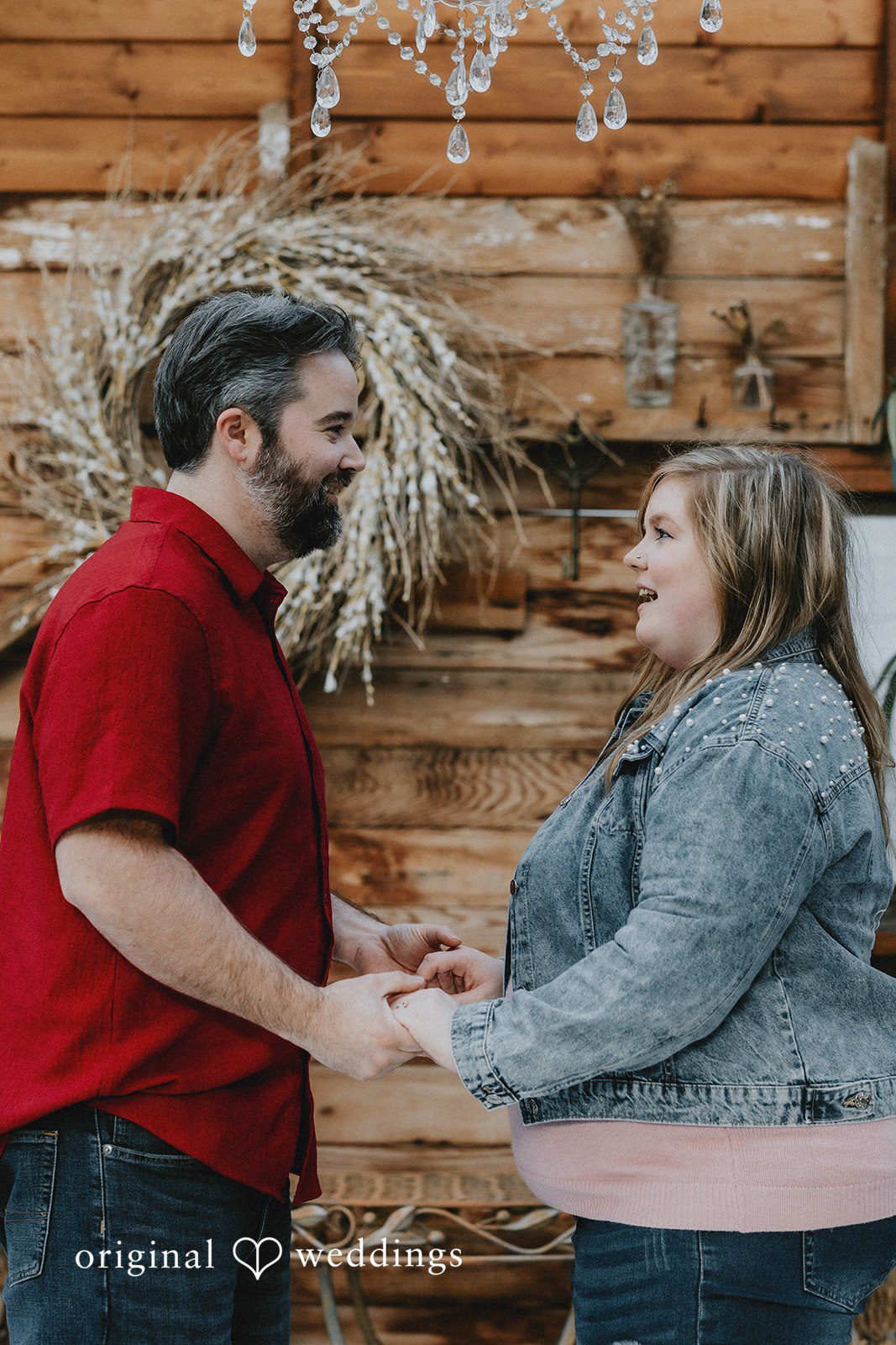 Romantic moment of couple holding hands at Hidden Farm & Stables.