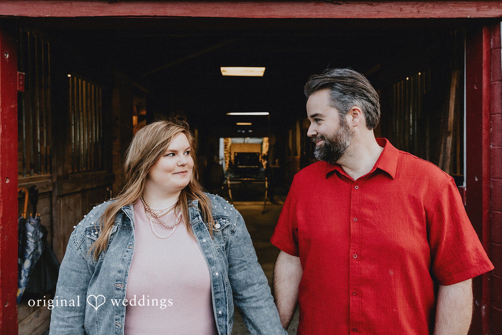 Couple looking at each other at Hidden Farm & Stables