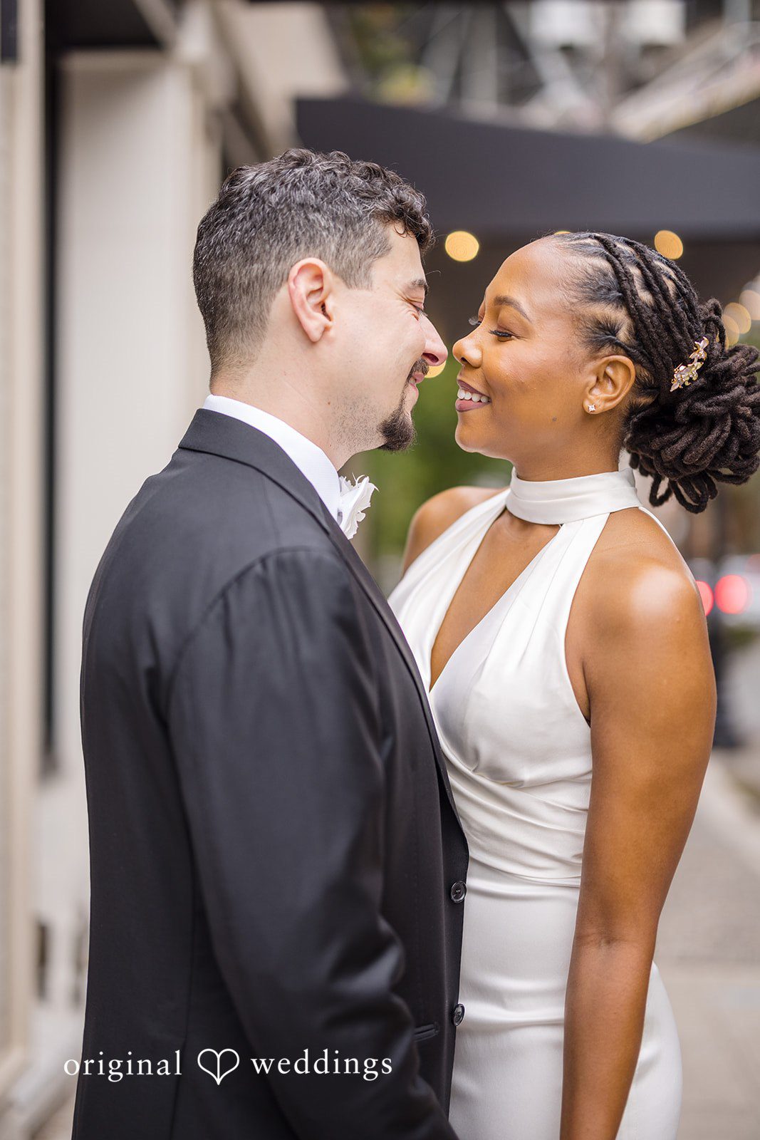 Patrick + Barbara Jean Bride and groom holding hands while walking together at the venue entrance.