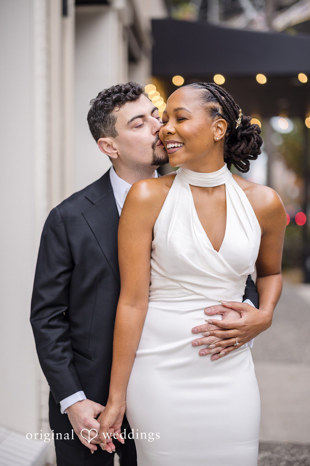 Patrick + Barbara Jean Bride and groom sharing a romantic moment outdoors.