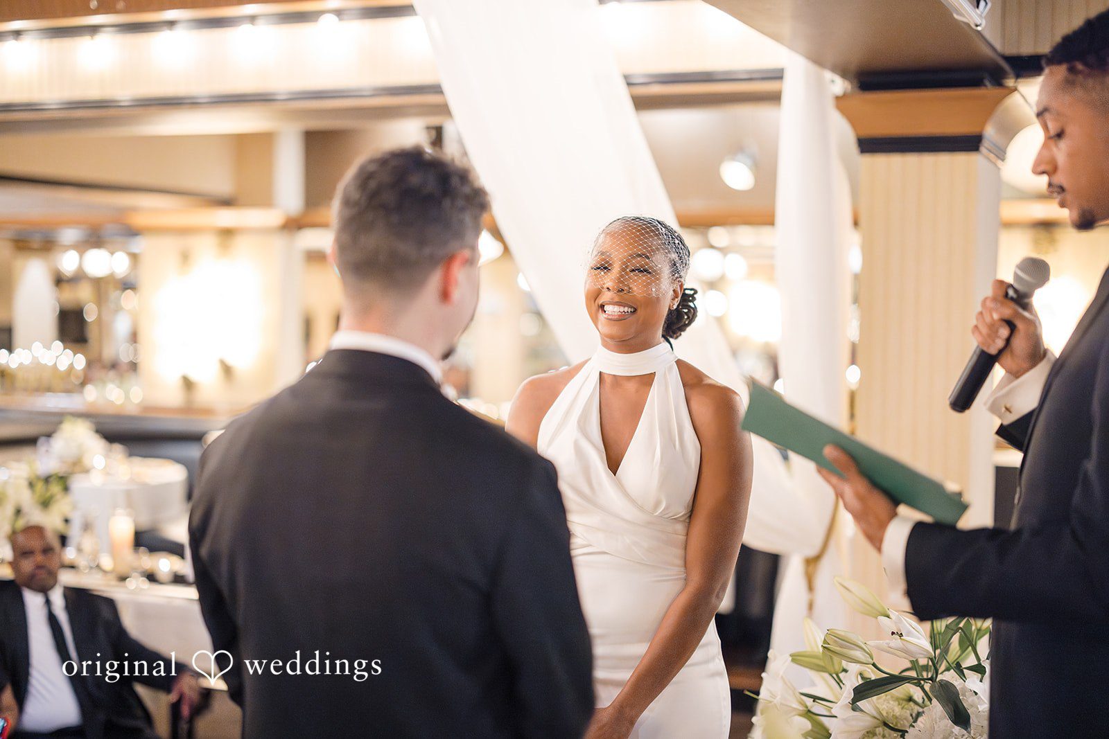 Patrick + Barbara Jean Bride speaking during the ceremony while guests listen.